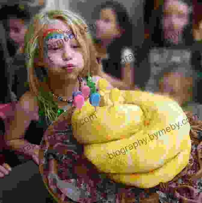 A Delighted Girl Holding A Cake With A Snake Figurine On Top A Snake In The Cake (Wiggles The Snake 3)