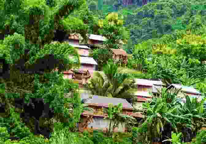 A Scenic Shot Of A Gebusi Village Nestled Amidst Lush Rainforest The Gebusi: Lives Transformed In A Rainforest World