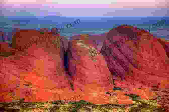 A Stunning Panoramic View Of Uluru (Ayers Rock) And Kata Tjuta (The Olgas) At Sunrise, With A Group Of Travelers Admiring Its Beauty. Australian Memories: Discover Aussie Land And The Mysterious Red Center (Travels And Adventures Of Ndeye Labadens 1)